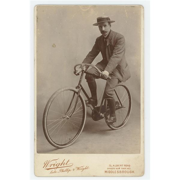 Mustached Englishman on Bicycle Cabinet Photo