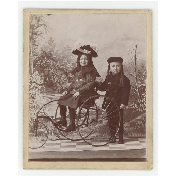 Children on Tricycle Cabinet Photo
