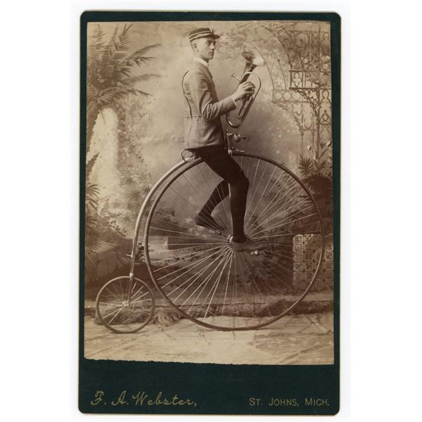 Musician on High Wheel Bicycle Cabinet Photo