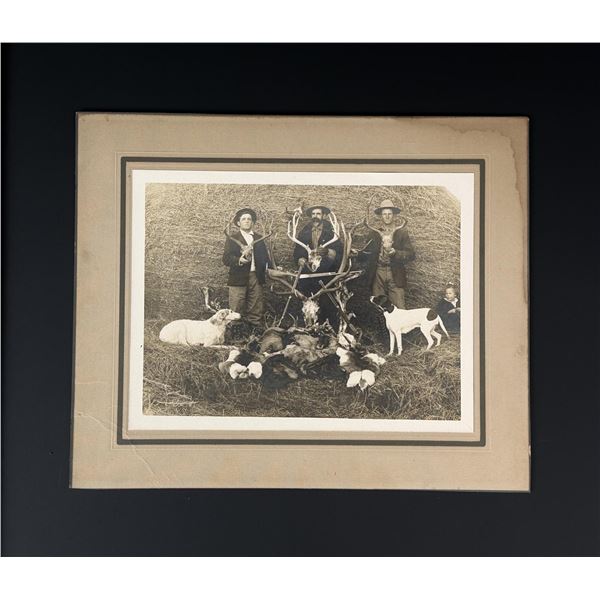 Men Posing with Hunting Trophies Photo