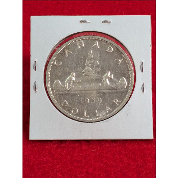 1959 Canadian $1 Voyageur Silver Dollar.