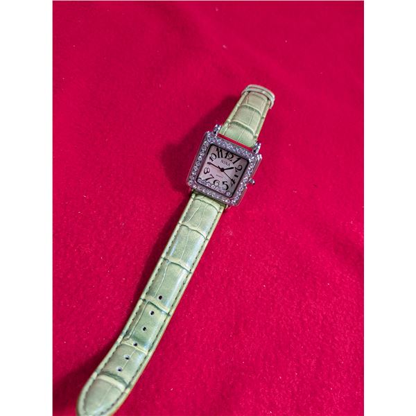 Nina brand quartz analog wristwatch featuring a square case with a crystal-embellished bezel and a l
