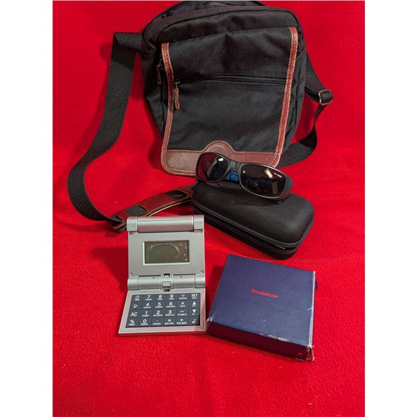 SHOULDER TRAVEL BAG, travel clock & Italian Sunglasses.