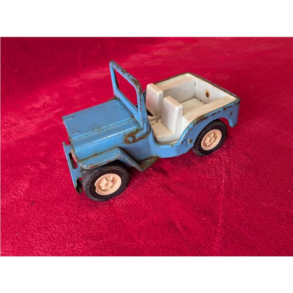 Vintage 1960's-1970's blue and white pressed-steel Tonka Jeep toy.