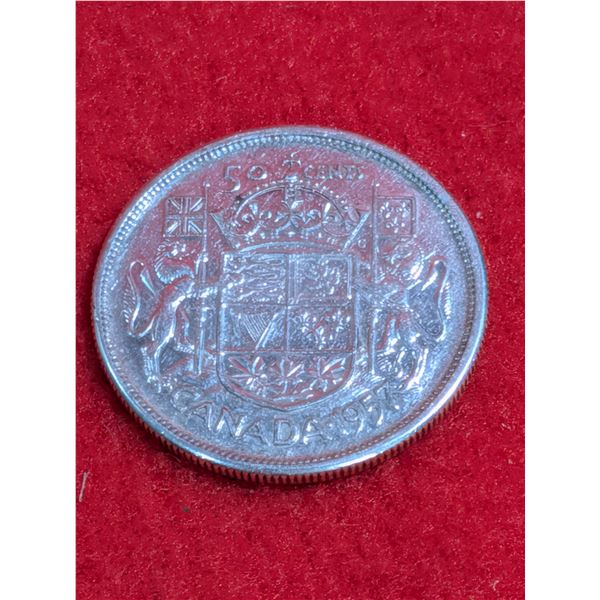 1957 Canadian 50-cent silver coin.
