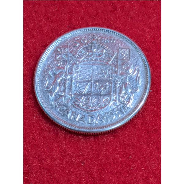 1957 Canadian 50-cent silver coin.
