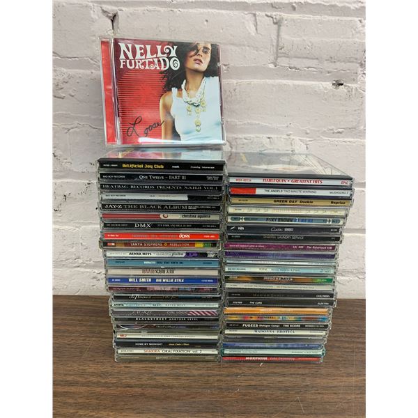 Lot of 48 CDs Nelly Furtado, Green Day, Madonna, Shakira, etc