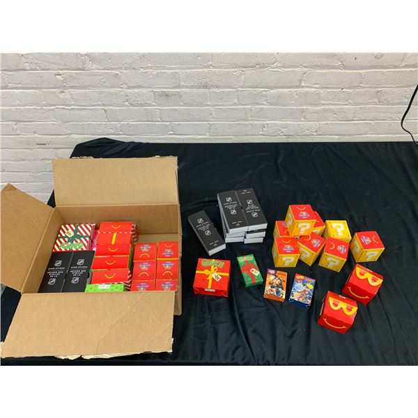 Box of Modern Happy Meal Toys Mario Galaxy Movie, The Grinch, Anime Uno, NHL Star Sticks, etc