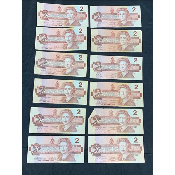 Lot of 12 1986 $2 Canadian Paper Bills