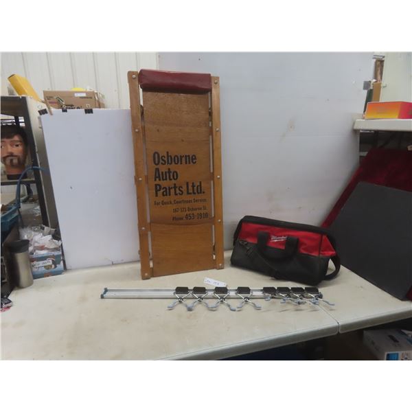 Garage Creeper with 'Osborne Auto Parts' Advertising, Milwaukee Bag, and Wall Mount Organizer Rack