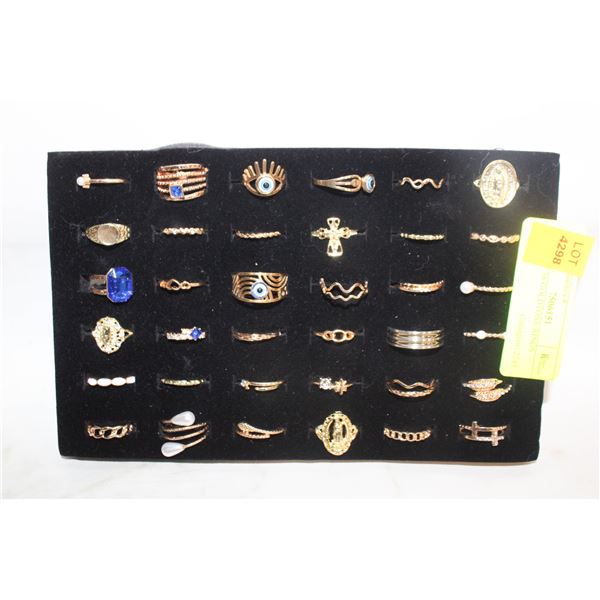 TRAY W/36 GOLDTONE RINGS