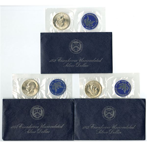 U.S., Eisenhower 1972, 1973, and 1974 Blue Pack Uncirculated Silver Dollar Trio