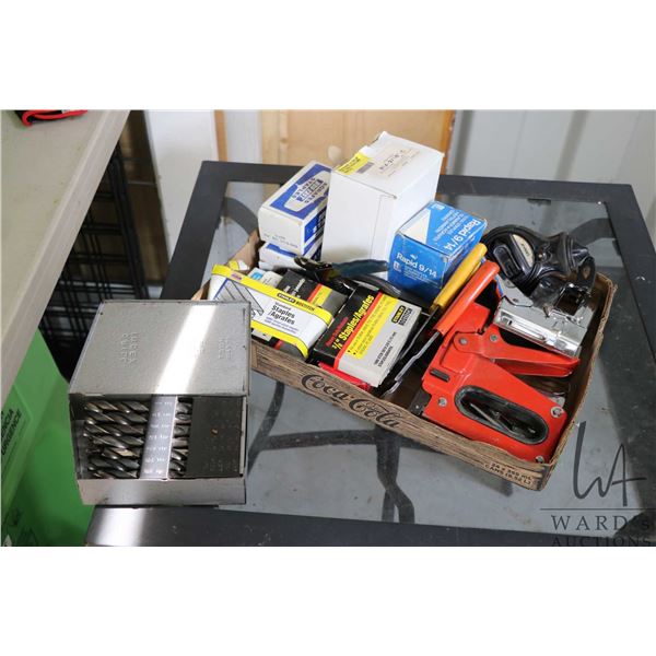 Large selection of hand tools including staplers, staples, wire strippers, chalk line, etc