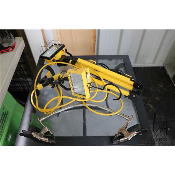 Two halogen worklights, one stand, and joined clamps