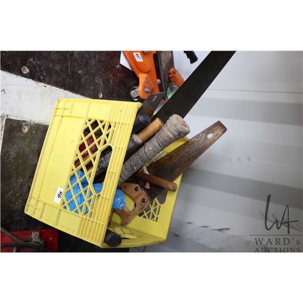 Selection of tools including hammers, saws, adjustable wrenches, etc