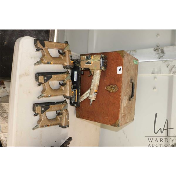 Fitted wooden case with 4 assorted Duo-Fast air nailers and staples, not tested at time of catalougi