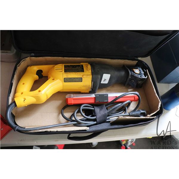 DeWalt DW304P chorded reciprocating saw with selection of blades, in original soft case, working at 
