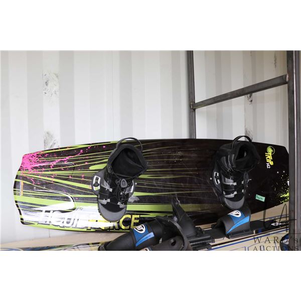 Redmon Liquid Force Trip 142 wake board, measures 141.9 x 43.8, comes with boots and bindings