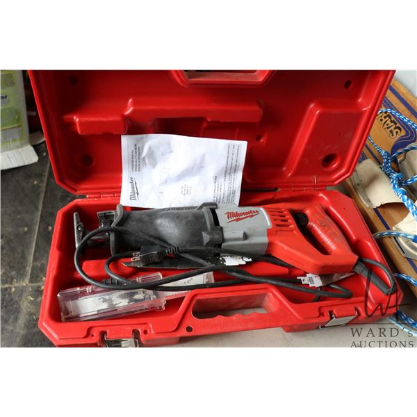 Milwaukee 6519-30 Sawzall corded reciprocating saw with extra blades and fitted hard case, working a