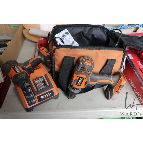 Selection of 18v Rigid cordless tools including variable speed drill, impact, 4 batteries and a char