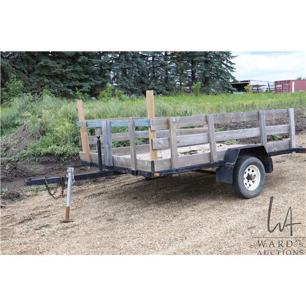 Tilt deck trailer with 7'x10' bed with 24" wooden stake sides, 13" tires, no serial number present