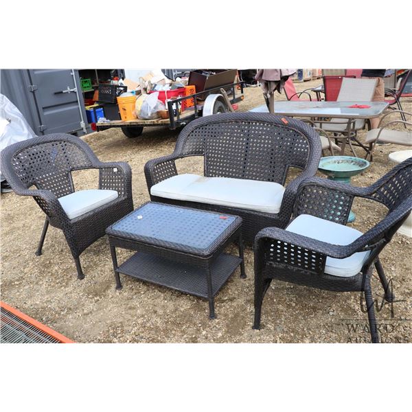 4 piece patio furniture set in black plastic wicker including 2 chairs, loveseat, and table