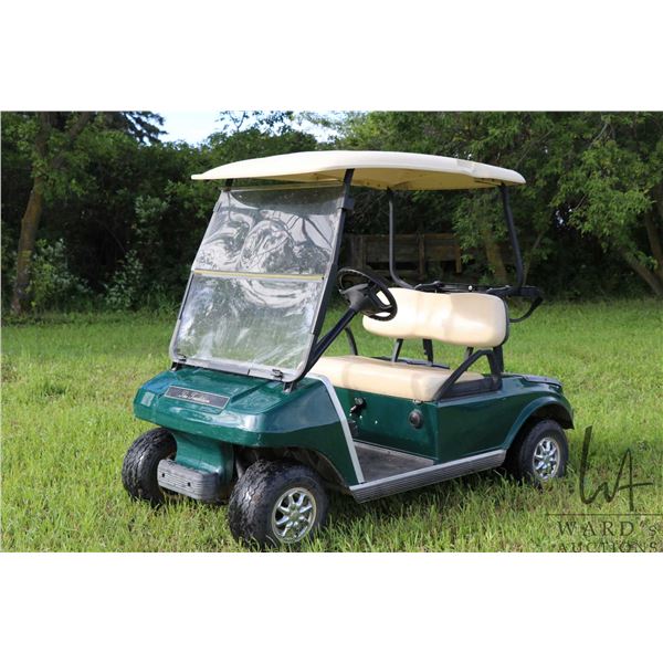 The Tradition Club Car 2 seater gas powered golf cart, includes rain cover, runs and drives VIN AGO5