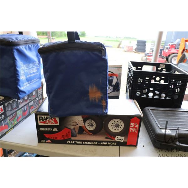 Boxed Anderson Rapid Jack tire change system and a set of Woodys RV leveling blocks
