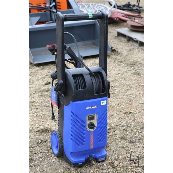 Simoniz 2000 PSI electric pressure washer with swappable heads and tips, working at time of cataloug