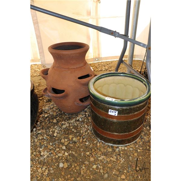 3 planters including a terracotta multi-level planter, a green ceramic planter, and a metal brass an