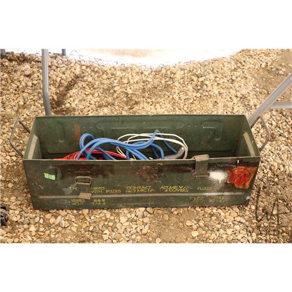 Metal military ammo box with a set of booster cables and a vintage Firestone battery charger