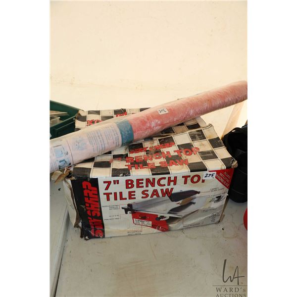 Stay Sharp 7" benchtop tile saw and a partial role of waterproof membrane