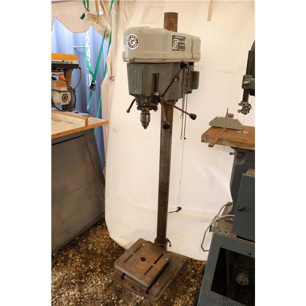 Rockwell floorstanding drill press with adjustable work table, working at time of catalouging