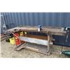 Image 1 : Homemade workbench with 2 built in vices, and one attached vice. Approx 89inches wide