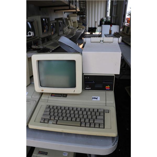 Vintage 1980s Apple IIE with Apple Disk II disk drive, Apple Monitor and stand. See photos for inter