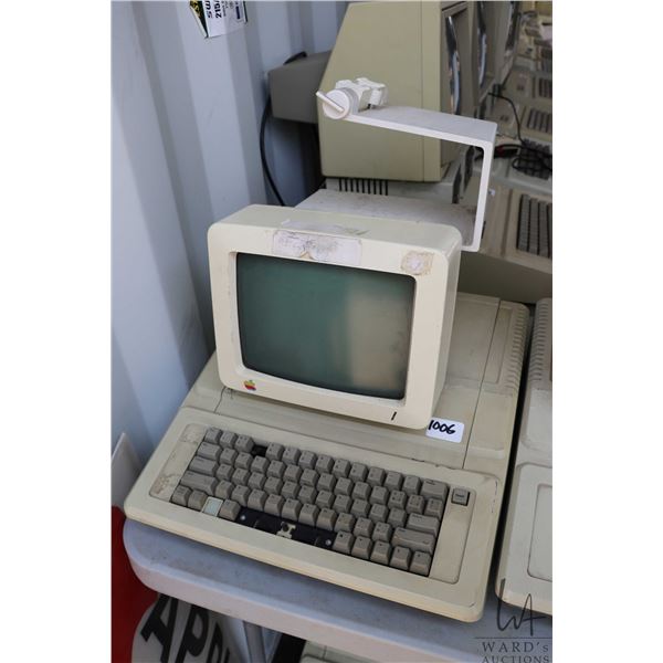 Vintage 1980s Apple IIE with Apple Monitor and stand. See photos for internals , untested at time of