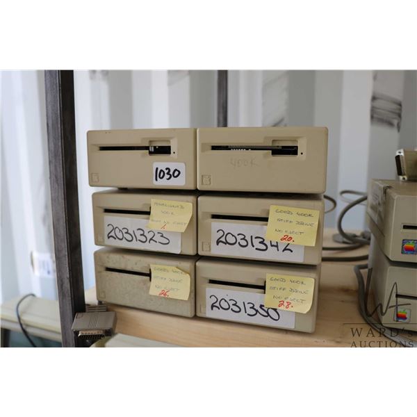Six vintage Apple M0130 external disk drives. Untested at time of cataloguing