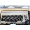 Image 7 : Vintage Commodore 64 with power supply, two joysticks, games including Pac-Man, Sea Wolf, Lemans, Ra