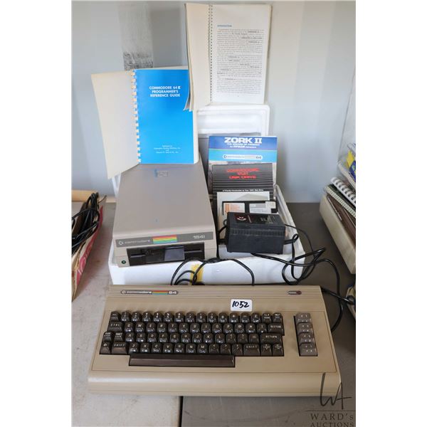 Vintage Commodore 64 with power supply, Commodore 154I external Disk Drive, guide books, Zork II. Un