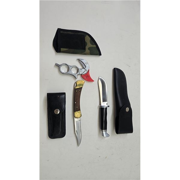 Selection of knives including Buck folding 110 w/ leather case, Buck 103 w/ leather sheath and a Wyo