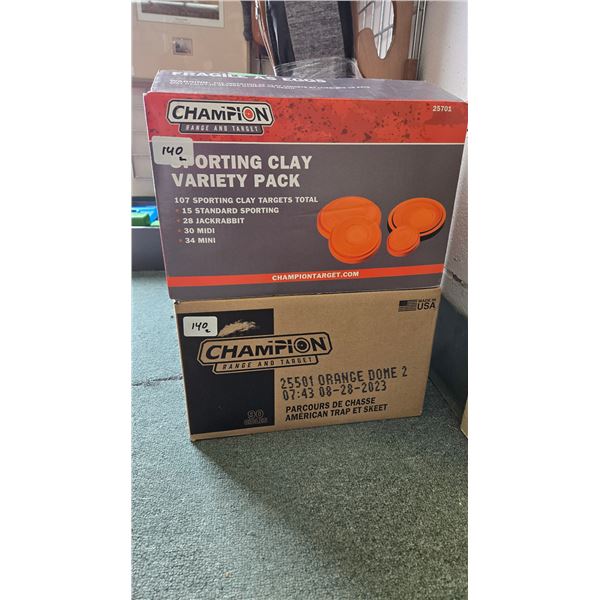 2 boxes of Champion mixed sized clay targets including 1 full 107 count box and a full 90 count box