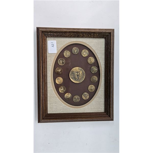 Limited edition Ducks Unlimited 50 year medallion and 14 lapel pins mounted and framed