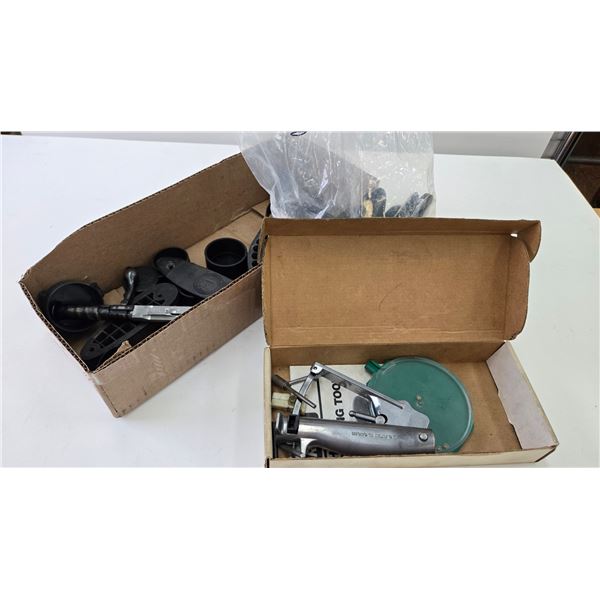 Selection of gun parts including Savage Mark II bolt, assorted butt plates, scope lens covers, and a