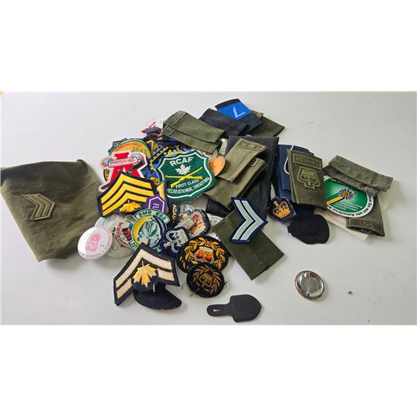 Selection of Canadian military badges, pins, and stickers plus European stickers