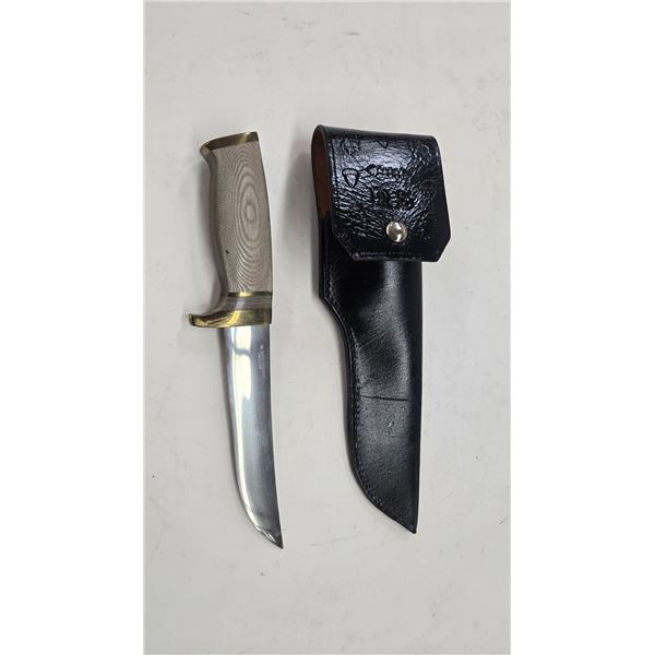 W. Stockdale hunting knife with 6" blade, brass accents, and leather sheath