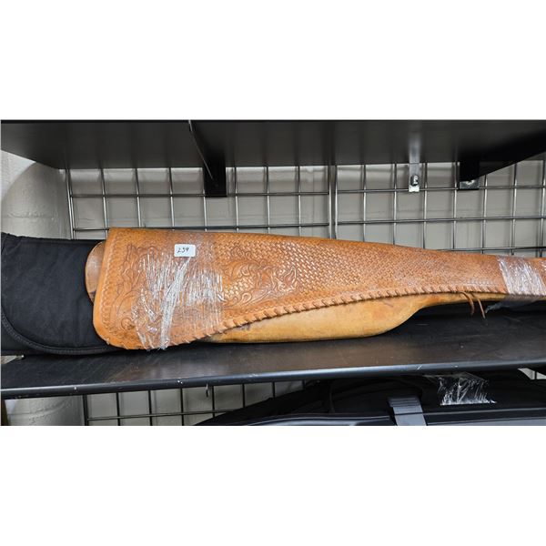 2 vintage leather gun cases, one with extensive tooling and 2 soft gun cases