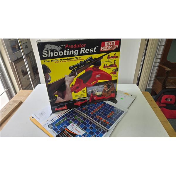 MTM Predator shooting rest in original box and an assortment of targets