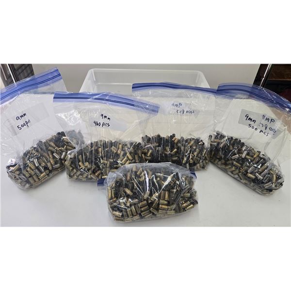 4 bags containing 2360 used 9mm brass