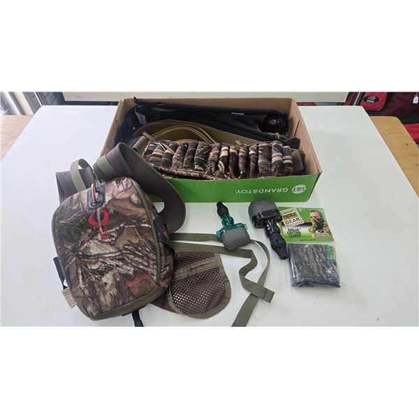 Selection of hunting supplies including ammo belt and pouch, rifle slings, animals calls, webbed bel