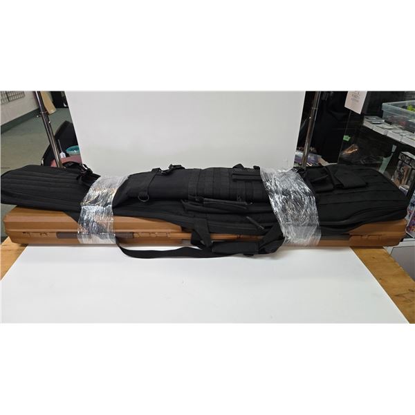 Plastic rifle case 48" x 9" x 3 1/2", a Cabela's soft tactical case and a rifle scabbard